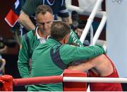 11 August 2012; John Joe Nevin, Ireland, is consoled by Team Ireland boxing head coach Billy Walsh, left, and Team Ireland boxing technical & tactical head coach Zaur Anita after his men's bantam 56kg final contest. London 2012 Olympic Games, Boxing, South Arena 2, ExCeL Arena, Royal Victoria Dock, London, England. Picture credit: Brendan Moran / SPORTSFILE