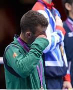 11 August 2012; Team Ireland's John Joe Nevin, men's bantam 56kg, wipes away a tear during the medal presentation. London 2012 Olympic Games, Boxing, South Arena 2, ExCeL Arena, Royal Victoria Dock, London, England. Picture credit: Brendan Moran / SPORTSFILE