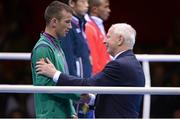 11 August 2012; Team Ireland's John Joe Nevin, men's bantam 56kg, is presented with his Olympic silver medal by Patrick Hickey, OCI President and recently elected member to the executive board of the International Olympic Committee. London 2012 Olympic Games, Boxing, South Arena 2, ExCeL Arena, Royal Victoria Dock, London, England. Picture credit: Brendan Moran / SPORTSFILE