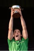 21 October 2017; Ireland captain Seán Finn lifts the cup after the U21 Shinty International match between Ireland and Scotland at Bught Park in Inverness, Scotland. Photo by Piaras Ó Mídheach/Sportsfile