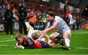 21 October 2017; Andrew Conway of Munster goes over to score his side's second try despite the efforts of Antoine Claassen of Racing 92 during the European Rugby Champions Cup Pool 4 Round 2 match between Munster and Racing 92 at Thomond Park in Limerick. Photo by Diarmuid Greene/Sportsfile