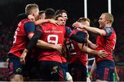 21 October 2017; Conor Murray of Munster (9) is congratulated by team-mates, including Chris Farrell, Ian Keatley and Keith Earls on scoring their side's first try during the European Rugby Champions Cup Pool 4 Round 2 match between Munster and Racing 92 at Thomond Park in Limerick. Photo by Brendan Moran/Sportsfile