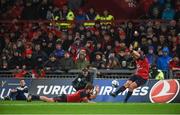 21 October 2017; Ian Keatley of Munster kicks a conversion with assistance from team mate Rhys Marshall during the European Rugby Champions Cup Pool 4 Round 2 match between Munster and Racing 92 at Thomond Park in Limerick. Photo by Diarmuid Greene/Sportsfile