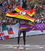 12 August 2012; Uganda's Stephen Kiprotich crosses the finish line to win the men's marathon. London 2012 Olympic Games, Athletics, The Mall, Westminster, London, England. Picture credit: Brendan Moran / SPORTSFILE
