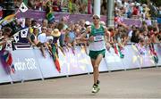 12 August 2012; Ireland's Mark Kenneally is cheered on as he comes down the finishing straight in the men's marathon where he finished in 57th place. London 2012 Olympic Games, Athletics, The Mall, Westminster, London, England. Picture credit: Brendan Moran / SPORTSFILE