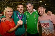 12 August 2012; Team Ireland's Michael Conlan, who won bronze in the men's fly 52kg, with his mother Theresa, father John and brother Jamie, after he was presented with his Olympic bronze medal. London 2012 Olympic Games, Boxing, South Arena 2, ExCeL Arena, Royal Victoria Dock, London, England. Picture credit: David Maher / SPORTSFILE