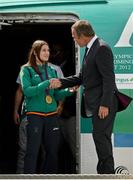 13 August 2012; Olympic champion Katie Taylor is greeted by Christoph Mueller, Chief Executive Officer of Aer Lingus, on Team Ireland's arrival home from the London 2012 Olympic Games. Dublin Airport, Dublin. Picture credit: Ray McManus / SPORTSFILE