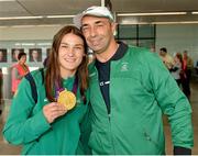 13 August 2012; Olympic champion Katie Taylor and her father and Team Ireland boxing coach Pete Taylor celebrate with her gold medal for boxing on their arrival home from the London 2012 Olympic Games. Dublin Airport, Dublin. Picture credit: Ray McManus / SPORTSFILE