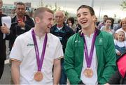 13 August 2012; Team Ireland's Michael Conlan, right, and Paddy Barnes, celebrate with their bronze medals for boxing on their arrival home from the London 2012 Olympic Games. Titanic Building, Titanic Quarter, Belfast, Co. Antrim. Picture credit: Oliver McVeigh / SPORTSFILE