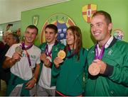 13 August 2012; Team Ireland medalists including Olympic champion Katie Taylor, gold, boxing, second from right, with from left, John Joe Nevin, silver, boxing, Michael Conlan, bronze, boxing, and Cian O'Connor, bronze, show jumping, on their arrival home from the London 2012 Olympic Games. Dublin Airport, Dublin. Picture credit: Ray McManus / SPORTSFILE
