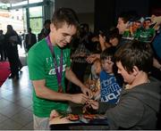13 August 2012; Team Ireland's Michael Conlan, with his bronze medal for boxing, signs autographs for supporters on his arrival home from the London 2012 Olympic Games. Titanic Building, Titanic Quarter, Belfast, Co. Antrim. Picture credit: Oliver McVeigh / SPORTSFILE