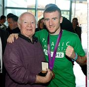 13 August 2012; Team Ireland's Paddy Barnes celebrates his bronze medal with Freddie Gilroy, bronze medal winner at the Melbourne 1956 Olympic Games, on his arrival home from the London 2012 Olympic Games. Titanic Building, Titanic Quarter, Belfast, Co. Antrim. Picture credit: Oliver McVeigh / SPORTSFILE