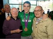 13 August 2012; Team Ireland's Michael Conlan celebrates his bronze medal with his grandfather Joe Strong, right, and Freddie Gilroy, bronze medal winner at the Melbourne 1956 Olympic Games, on his arrival home from the London 2012 Olympic Games. Titanic Building, Titanic Quarter, Belfast, Co. Antrim. Picture credit: Oliver McVeigh / SPORTSFILE