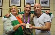 13 August 2012; Team Ireland's John Joe Nevin and his parents Winnie and Martin celebrate with his silver medal for boxing on his arrival home from the London 2012 Olympic Games. Mullingar, Co. Westmeath. Picture credit: Barry Cregg / SPORTSFILE