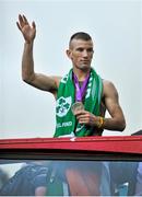 13 August 2012; Team Ireland's boxing silver medalist John Joe Nevin, waves to supporters from the open top bus on his arrival home from the London 2012 Olympic Games. Mullingar, Co. Westmeath. Picture credit: Barry Cregg / SPORTSFILE