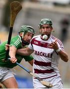 22 October 2017; Gerard Bradley of Slaughtneil is tackled by Caolan Bailie of Ballygalget during the AIB Ulster GAA Hurling Senior Club Championship Final match between Ballygalget and Slaughtneil at Athletic Grounds in Armagh. Photo by Ramsey Cardy/Sportsfile
