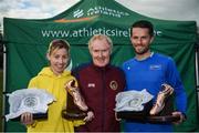 22 October 2017; Claire McCarthy, Leevale A.C., and Paddy Hamilton, Slieve Gullion Runners, receive the Jim McNamara Perpetual Trophy from Seán McMullin, President of the Irish Masters Athletes Association, during the Autumn Open Cross Country Festival at the National Sports Campus in Abbotstown, Dublin. Photo by Cody Glenn/Sportsfile