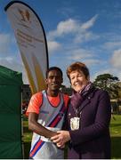 22 October 2017; Hiko Tonosa, Dundrum South Dublin A.C., receives his prize for first place finisher in the Senior Men's race from Mayor of Fingal Mary McCamley during the Autumn Open Cross Country Festival at the National Sports Campus in Abbotstown, Dublin. Photo by Cody Glenn/Sportsfile