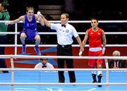 7 August 2012; Michael Conlan, Ireland, left, is declared winner over Nordine Oubaali, France, in their men's fly 52kg quarter-final contest. Conlon won on a scoreline of 22 points to 18. London 2012 Olympic Games, Boxing, South Arena 2, ExCeL Arena, Royal Victoria Dock, London, England. Picture credit: David Maher / SPORTSFILE