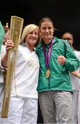 15 August 2012; Team Ireland boxing gold medallist Katie Taylor with former Republic of Ireland women's soccer international Oliva O'Toole during a Team Ireland London 2012 Olympic Games Public Reception. Dawson Street, Dublin. Picture credit: Stephen McCarthy / SPORTSFILE