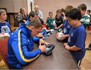 15 August 2012; Adio Kortbi, age 10, From Castleknock, Co. Dublin, has his rugby ball signed by Leinster's Heinke Van Der Merwe during the Garda RFC VW Leinster Rugby Summer Camp. Garda RFC, Westmanstown, Co. Dublin. Picture credit: Barry Cregg / SPORTSFILE