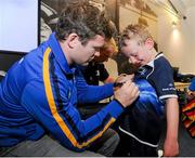 15 August 2012; Joshua Howard, age 7, from Lansdowne, has his Leinster jersey signed by Gordon D'Arcy during the Lansdowne RFC VW Leinster Rugby Summer Camp. Lansdowne RFC, Lansdowne Road, Dublin. Picture credit: Pat Murphy / SPORTSFILE