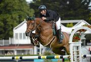 15 August 2012; Cian O'Connor, Ireland, competing on Kec Alligator Alley, jumps the 8th during the Irish Sports Council Classic. Dublin Horse Show 2012, Main Arena, RDS, Ballsbridge, Dublin. Picture credit: Matt Browne / SPORTSFILE