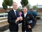 15 August 2012; Minister for Agriculture, Food and the Marine Simon Coveney T.D, with Team Ireland bronze medallist Cian O'Connor. Dublin Horse Show 2012, Main Arena, RDS, Ballsbridge, Dublin. Picture credit: Matt Browne / SPORTSFILE