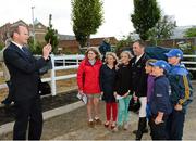 15 August 2012; Minister for Agriculture, Food and the Marine Simon Coveney T.D, takes a photograph on an IPhone of Team Ireland bronze medallist Cian O'Connor with members of Tipperary Pony Club, from left to right, Dorothy Wall, Emma Hatton, Zoe Stokes, Jack Ryan, James Phillips and Peter Wall. Dublin Horse Show 2012, Main Arena, RDS, Ballsbridge, Dublin. Picture credit: Matt Browne / SPORTSFILE