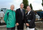 15 August 2012; Minister for Agriculture, Food and the Marine Simon Coveney T.D, centre, with Team Ireland bronze medallist Cian O'Connor, right, and Ireland team manager Robert Splaine. Dublin Horse Show 2012, Main Arena, RDS, Ballsbridge, Dublin. Picture credit: Matt Browne / SPORTSFILE