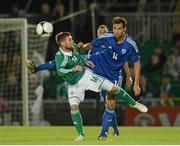 15 August 2012; Oliver Norwood, Northern Ireland, in action against Tim Sparv, Finland. Vauxhall International Challenge Match, Northern Ireland v Finland, Windsor Park, Belfast, Co. Antrim. Picture credit: Oliver McVeigh / SPORTSFILE