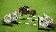 16 August 2012; Dermott Lennon, Ireland, competing on Hallmark Elite, jumps the 9th, on their way to finishing in second place, during the Knight Frank Speed Stakes. Dublin Horse Show 2012, Main Arena, RDS, Ballsbridge, Dublin. Picture credit: Matt Browne / SPORTSFILE