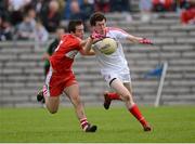 30 June 2012; Peter McKenna, Tyrone, in action against Conor Carville, Derry. Electric Ireland Ulster GAA Football Minor Championship Semi-Final, Derry v Tyrone, St Tiernach's Park, Clones, Co. Monaghan. Picture credit: Oliver McVeigh / SPORTSFILE