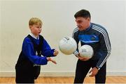 24 October 2017; Dublin footballer Paddy Andrews was in Holy Spirit BNS in Ballymun today at an AIG Heroes event with pupil Corban Murphy, 10, from Ballymun. The AIG Heroes initiative is a programme that leverages AIG’s sporting sponsorships to help provide positive role models and build confidence for young people in local communities. Photo by Sam Barnes/Sportsfile