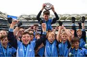 25 October 2017; Donabate Portrane Educate Together players and captain James Davison celebrate with the shield after victory during day 1 of the Allianz Cumann na mBunscol Finals at Croke Park, in Dublin.  Photo by Cody Glenn/Sportsfile