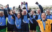 25 October 2017; Abby McMahon, with cup, and her Donabate Portrane Educate Together team-mates celebrate after victory during day 1 of the Allianz Cumann na mBunscol Finals at Croke Park in Dublin. Photo by Cody Glenn/Sportsfile