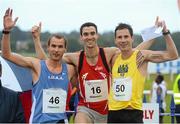16 August 2012; Winner Eoin Everard, Kilkenny City Harriers AC, with second placed, Dave Campbell, UCD, right, and third placed Joe Warne, DCU, left, after the Athletics Ireland Barefoot Mile. Athletics Ireland Barefoot Mile, Leopardstown Racecourse, Leopardstown, Co. Dublin. Picture credit: Pat Murphy / SPORTSFILE