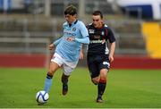5 August 2012; Luca Scapuzzi, Manchester City, in action against Shane Tracy, Limerick FC. Soccer Friendly, Limerick FC v Manchester City, Thomond Park, Limerick. Picture credit: Gareth Williams / SPORTSFILE