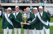 17 August 2012; Chef d'Equipe Robert Splaine celebrates with the Aga Khan trophy following victory in the FEI Nations Cup with his team, from left, Darragh Kerins, Richie Moloney, Cian O'Connor and Clem McMahon. Dublin Horse Show 2012, Main Arena, RDS, Ballsbridge, Dublin. Picture credit: Matt Browne / SPORTSFILE