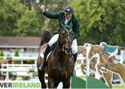 17 August 2012; Clem McMahon, Ireland, competing on Pacino, celebrates after jumping the last for a double clear round to help his team win the FEI Nations Cup. Dublin Horse Show 2012, Main Arena, RDS, Ballsbridge, Dublin. Picture credit: Matt Browne / SPORTSFILE