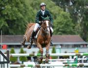 17 August 2012; Richie Moloney, Ireland, competing on Ahorn Van De Zuuthoeve, jumps the last during the FEI Nations Cup. Dublin Horse Show 2012, Main Arena, RDS, Ballsbridge, Dublin. Picture credit: Matt Browne / SPORTSFILE