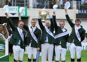 17 August 2012; Chef d'Equipe Robert Splaine lifts the Aga Khan trophy following victory in the FEI Nations Cup with his team, from left, Darragh Kerins, Richie Moloney, Cian O'Connor and Clem McMahon. Dublin Horse Show 2012, Main Arena, RDS, Ballsbridge, Dublin. Picture credit: Matt Browne / SPORTSFILE