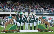 17 August 2012; Chef d'Equipe Robert Splaine celebrates with the Aga Khan trophy following victory in the FEI Nations Cup with his team, from left, Darragh Kerins, Richie Moloney, Cian O'Connor and Clem McMahon. Dublin Horse Show 2012, Main Arena, RDS, Ballsbridge, Dublin. Picture credit: Matt Browne / SPORTSFILE