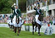 17 August 2012; Richie Moloney, left, Ireland, on Ahorn Van De Zuuthoeve and Clem McMahon, Ireland, on Pacino, celebrate after their team's victory in the FEI Nations Cup. Dublin Horse Show 2012, Main Arena, RDS, Ballsbridge, Dublin. Picture credit: Matt Browne / SPORTSFILE