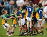 19 August 2012; Players from  Erne Valley, Co. Cavan, celebrate after victory over Clarinbridge, Co.Galway, competing in the Gaelic Football Mixed U10, during the Community Games national finals. Athlone, Co Westmeath. Picture credit: David Maher / SPORTSFILE