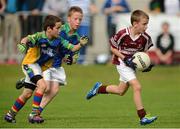 19 August 2012;  Michael Donoghue, Clarinbridge, Co. Galway, in action against Cormac Brady, Erne Valley, Co. Cavan competing in the Gaelic Football Mixed U10, during the Community Games national finals. Athlone, Co Westmeath. Picture credit: David Maher / SPORTSFILE