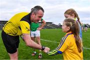 22 October 2017; Referee Brendan Healy is presented with the match ball by mascots Juliette Fallon, 6, and Lauren Walsh, 9, ahead of the Roscommon County Senior Football Championship Final match between St Brigid's and Roscommon Gaels at Dr Hyde Park in Roscommon. Photo by Sam Barnes/Sportsfile