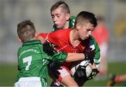 27 October 2017; Tomas O Muireagain of Gaelscoil Chluain Dolcain in action against Sean Beatley, left, and Daniel Gilmartin of Clonburris, during day 3 of the Allianz Cumann na mBunscol Finals at Croke Park, in Dublin. Photo by David Fitzgerald/Sportsfile