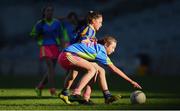 27 October 2017; Sophie Ni Mhathuna of Scoil Bhride Raghnallach in action against Hannah Brennan of St. Patrick's GNS during day 3 of the Allianz Cumann na mBunscol Finals at Croke Park, in Dublin. Photo by David Fitzgerald/Sportsfile
