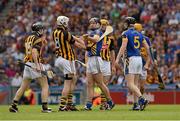 19 August 2012; Kilkenny and Tipperary players jostle with each other in the first 60 seconds of the game. GAA Hurling All-Ireland Senior Championship Semi-Final, Kilkenny v Tipperary, Croke Park, Dublin. Picture credit: Ray McManus / SPORTSFILE